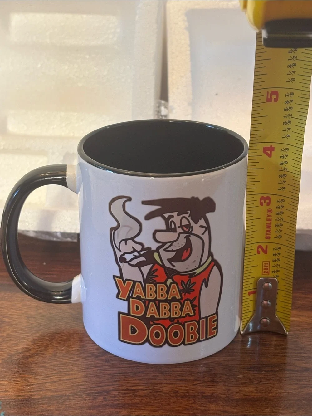 Novelty White Ceramic Coffee Mug with Black Handle - Yabba Dabba Doobie Design